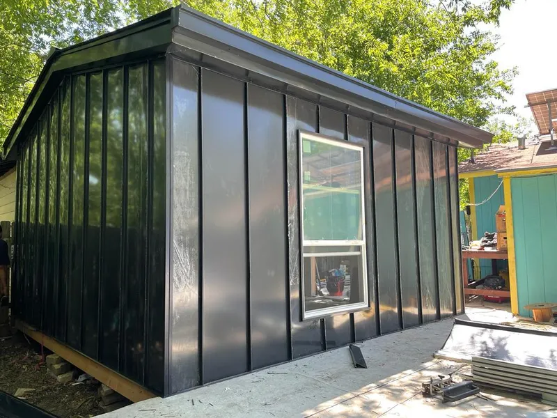 Black standing seam metal wall panels for Roof Inspection in Earlimart